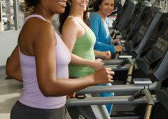 Women Exercising on Treadmills at Health Club